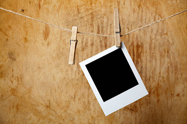 istock Blank picture frame hanging on clothesline 120801370