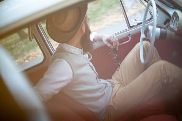 istock Hipster men traveling in his old timer 1208013840