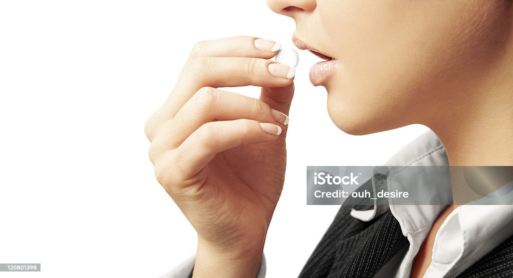 Mulher tomando um comprimido. - Foto de stock de Comprimido royalty-free