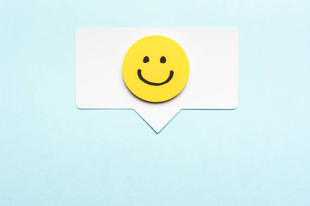 istock Happy face emoticon smiling comment on speech bubble and blue background. Social media marketing concept. 1208016463