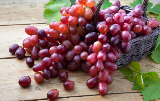 Red Grapes overflowing out of basket