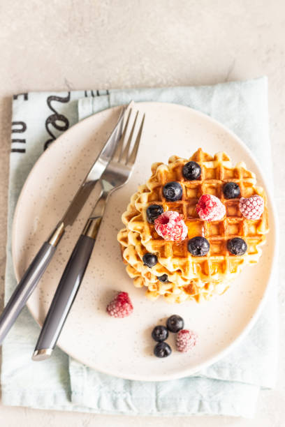 istock Stack of belgian vanilla waffles with berry (blueberry and raspberry) and honey. Copy space. 1208017626