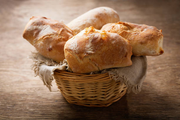 istock fresh bread in a basket on a wooden table 1208018904