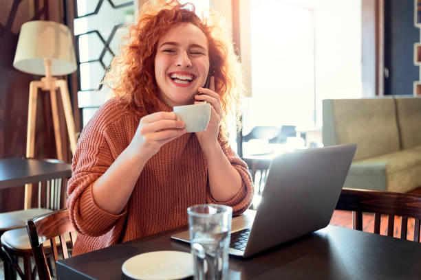 istock Redhead woman drinking coffee enjoin conversation 1208019859