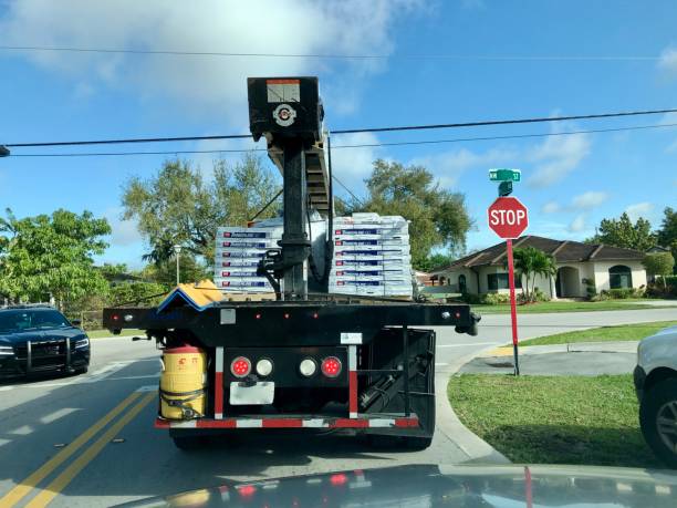 2/21/20020 Miami, FL-bundles of roofing shingles on roofing conveyor truck for home delivery.