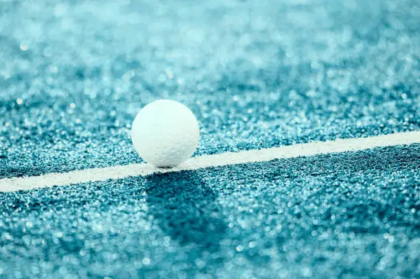 Photo of White ball for playing field hockey. Blue filter