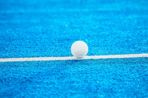 Photo of White ball for playing field hockey. Blue filter