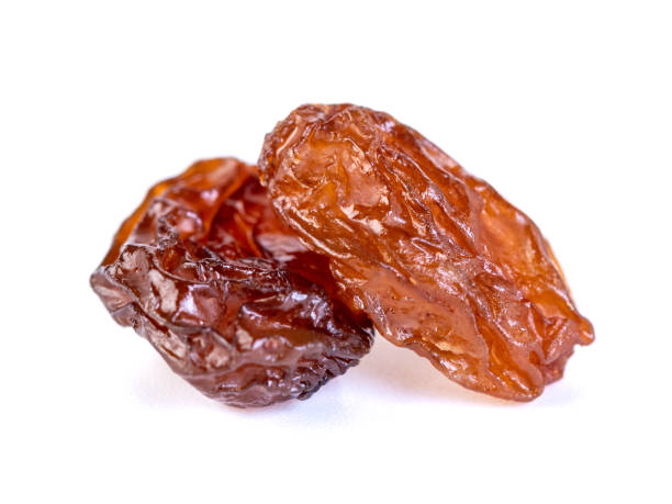 istock Raw raisins, dried grape isolated on white background 1208023481