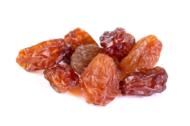 istock Raw raisins, dried grape isolated on white background 1208023642