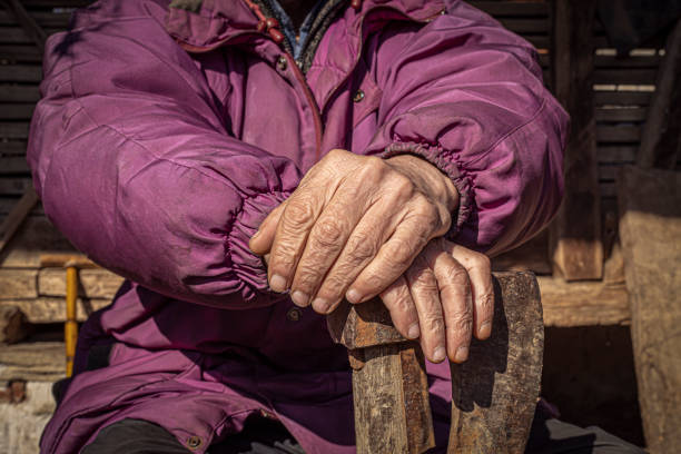 istock Close up of the old carpenter's hands 1208024515