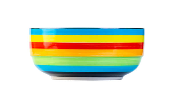 istock Colorful striped ceramic bowl isolated on a white background 1208024796