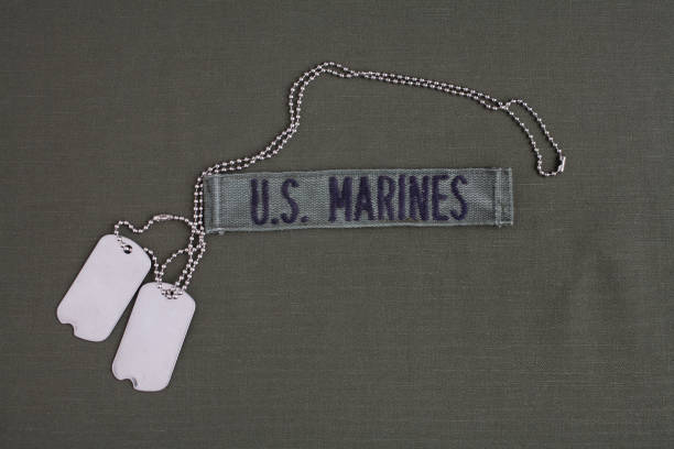 istock U.S. MARINES Tape with dog tags on olive green uniform 1208025641