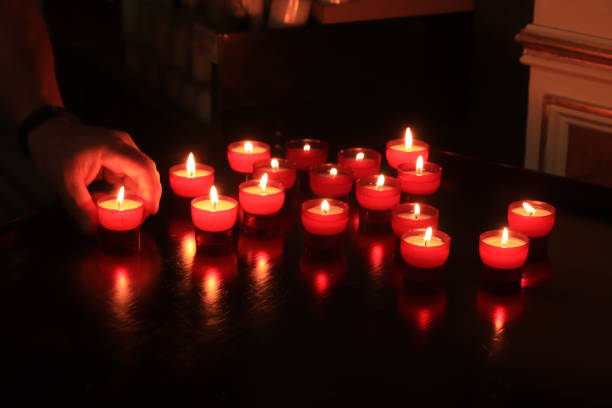 istock Votive candles in a church 1208028475