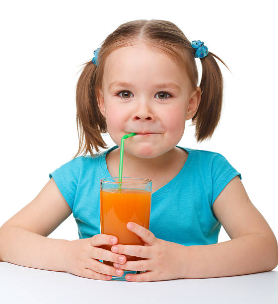 istock Little girl drinks orange juice 120803395