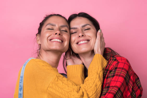 istock Portrait of beautiful twins 1208044886
