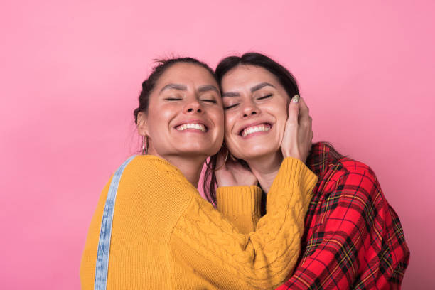istock Portrait of beautiful twins 1208044889