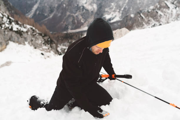 istock Mountaineer rescue using an avalanche rescue kit 1208044997