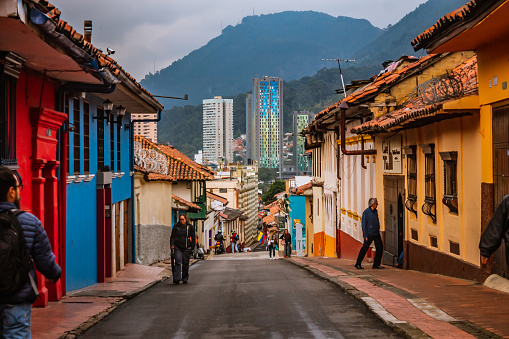 Street of La Candelaria, the historic center of Bogotá, on a cloudy day, with streets from the colonial era of the city, a popular place for tourists, Bogotá Colombia, February 21, 2020