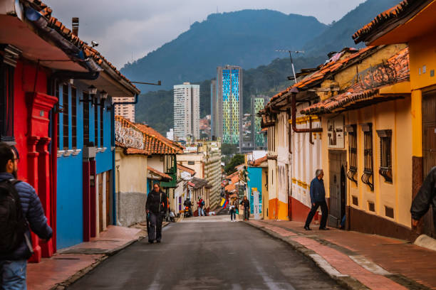 Street of La Candelaria Bogotá Street of La Candelaria, the historic center of Bogotá, on a cloudy day, with streets from the colonial era of the city, a popular place for tourists, Bogotá Colombia, February 21, 2020 candlemas stock pictures, royalty-free photos & images