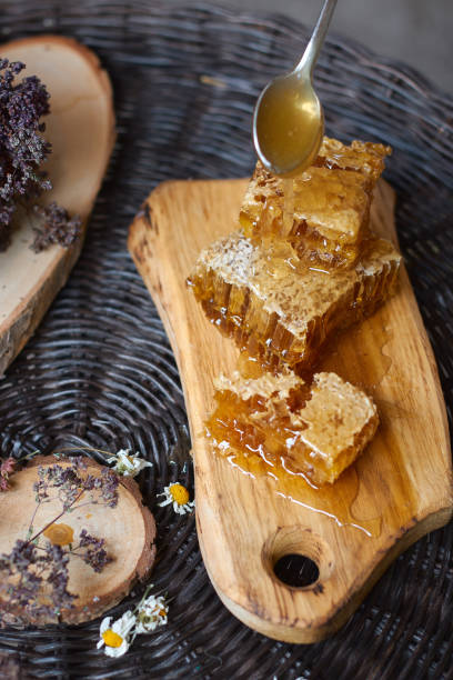 istock flat lay composition on a wicker table with honey comb on a wooden board 1208047823