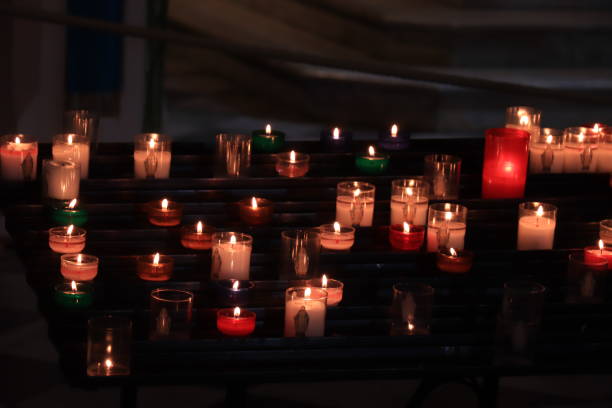 istock Votive candles in a church 1208049642
