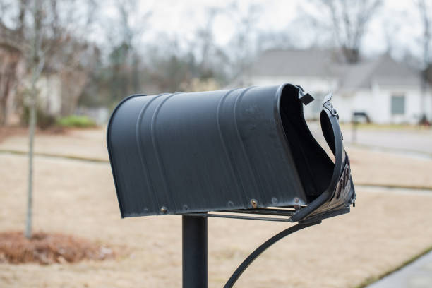 istock Mailbox that has been hit and damaged by car 1208052410