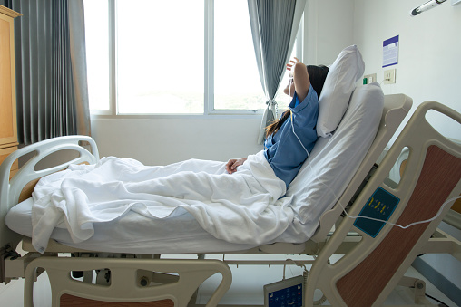 Conceptual of sickness woman feeling when admitted in the hospital.