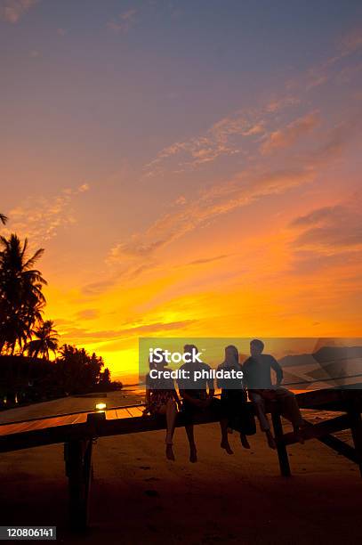 Drinks At Sunset Stock Photo - Download Image Now - Friendship, Sunset, 20-29 Years