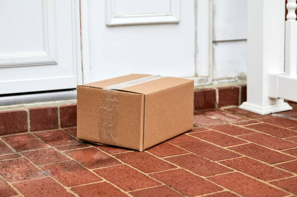 Package on Front Door Step stock photo