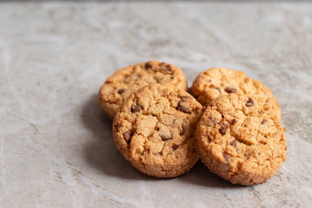 istock Freshly baked cookies placed on marbled texture 1208061767