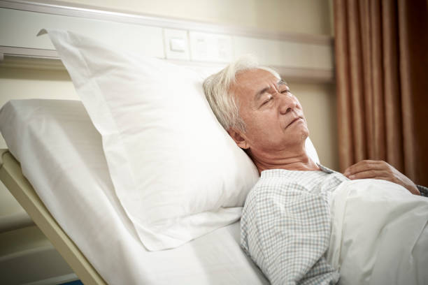 Asian Old Man Lying On Back On Hospital Bed Stock Photo - Download Image Now - Bed - Furniture, Senior Adult, Patient - iStock