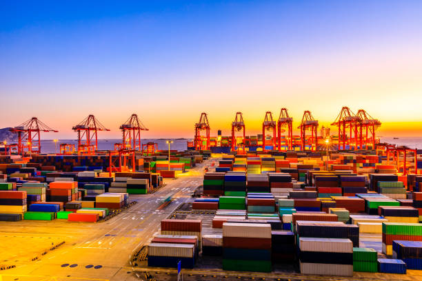 istock Industrial port container freight terminal at beautiful sunset in Shanghai. 1208062911