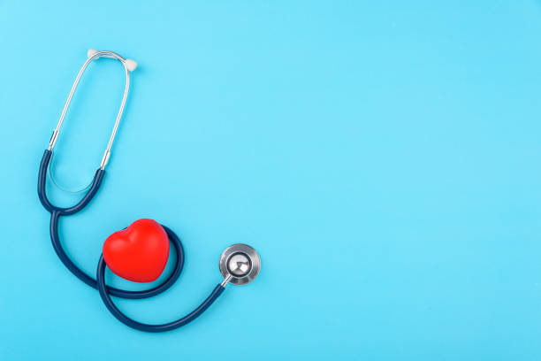 Doctor's Day concept, flat lay top view, stethoscope with red hearts diagnosis of heart disease on blue background Doctor's Day concept, flat lay top view, stethoscope with red hearts diagnosis of heart disease on blue background with copy space for text heart internal organ photos stock pictures, royalty-free photos & images