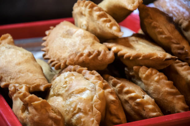 istock Tray of deep fried chicken curry puffs 1208065057
