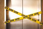 out of service elevator with yellow tape