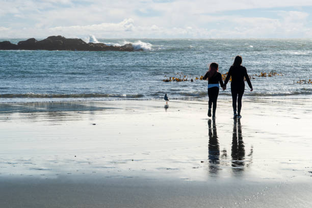 istock Mother daughter portrait at beach 1208070775