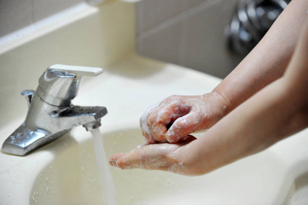 istock Washing hands with soap and water 1208070862