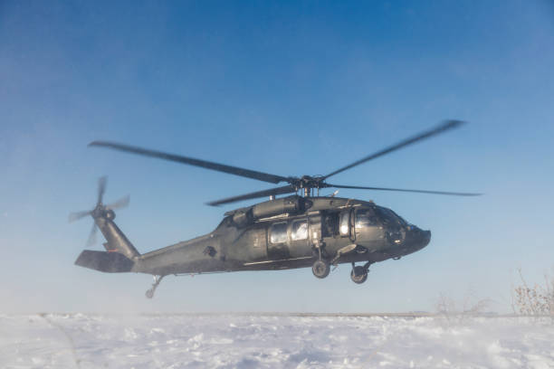 istock UH-60 Blackhawk Military Helicopter landing on snow 1208079907