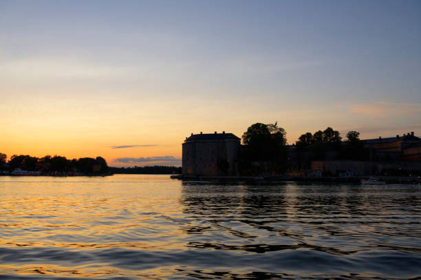 istock Island on the water over sunset sky 1208080857