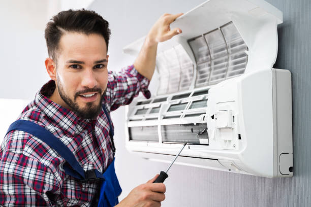 istock Repairer Repairing Air Conditioner 1208084855