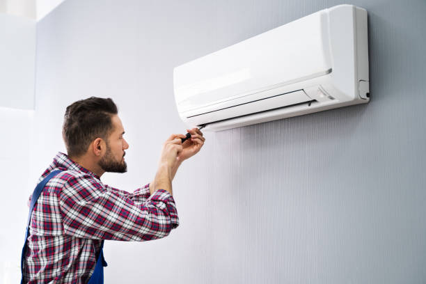 istock Repairer Repairing Air Conditioner 1208084857