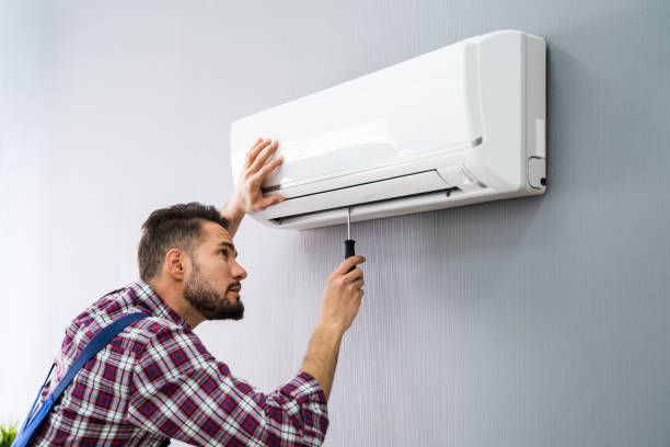 istock Repairer Repairing Air Conditioner 1208084861