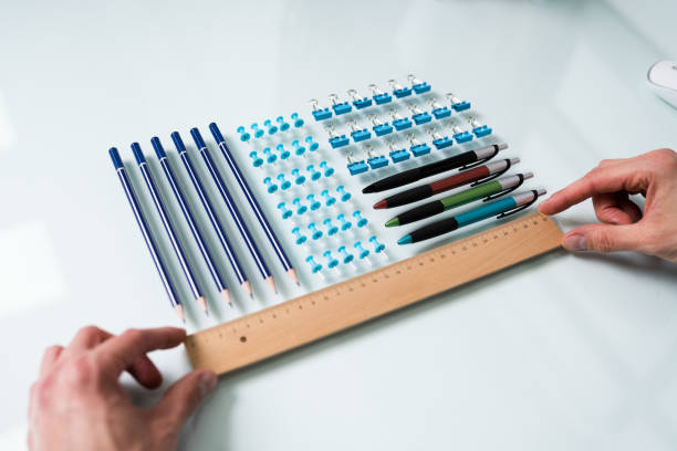 istock Person Arranging The Clips With Scale 1208084993