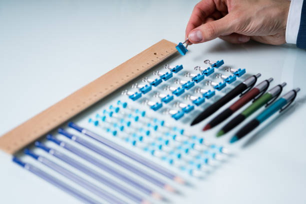 istock Person Arranging The Clips With Scale 1208085015