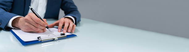 istock Person Signing Contract 1208085136