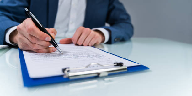 istock Person Signing Contract 1208085219