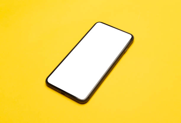 istock Black smartphone with blank screen mockup isolated on yellow background. Clipping path 1208087496