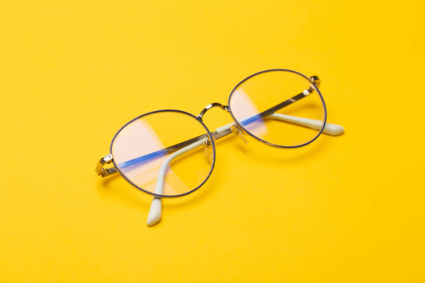 istock Eye glasses isolated on yellow background 1208088015