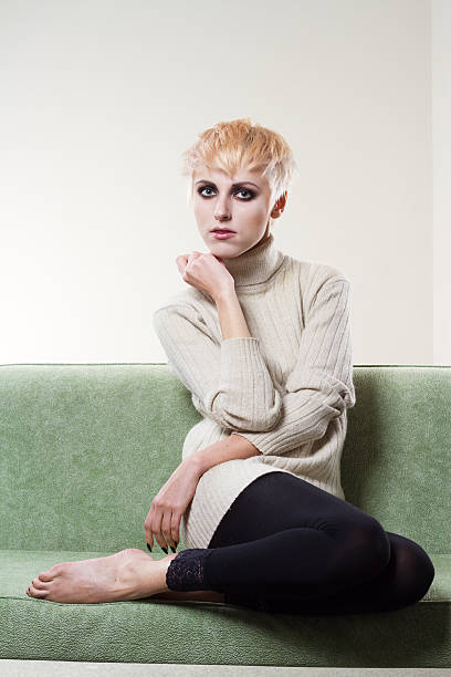 istock Young beautiful sad woman sitting on sofa 120808816