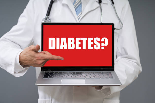 istock Doctor Holding Laptop With Diabetes Text 1208089222